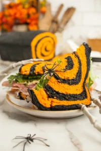 Delicious Halloween Bread shaped like a spooky pumpkin for festive celebrations.