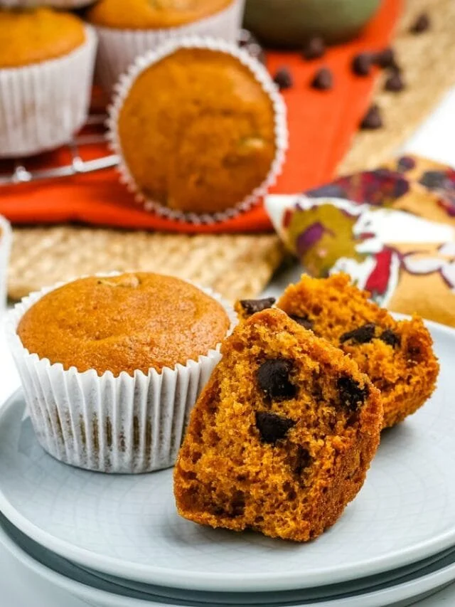 Freshly baked Pumpkin Chocolate Chip Muffins with chocolate chips