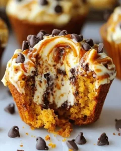 Delicious pumpkin chocolate chip muffins with cream cheese filling